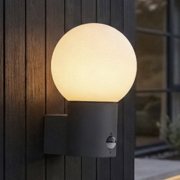Kültéri fali lámpa mozgás- és alkonyérzékelővel STONO 1xE27/15W/230V IP65 antracit