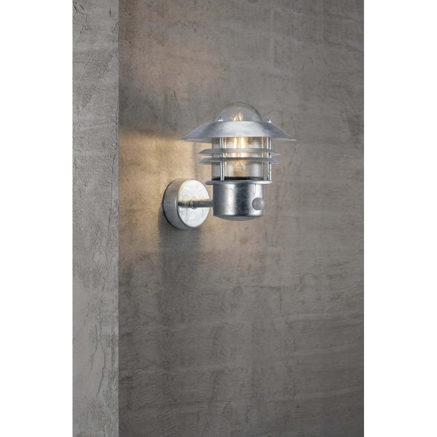 Nordlux - Kültéri fali lámpa érzékelővel BLOKHUS 1xE27/60W/230V IP54 ezüst